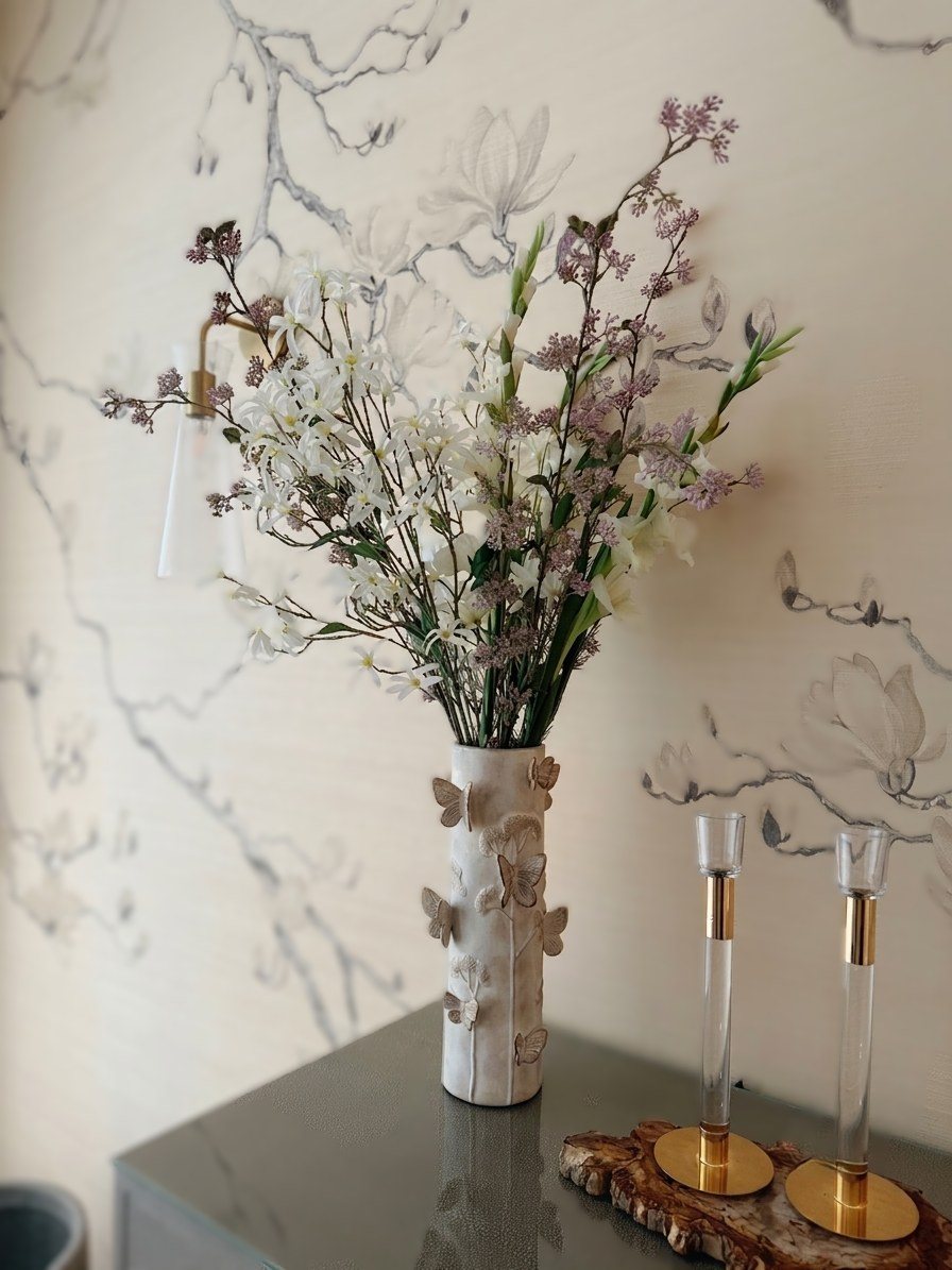 Bloom arrangement — white and lavender florals in a butterfly vase